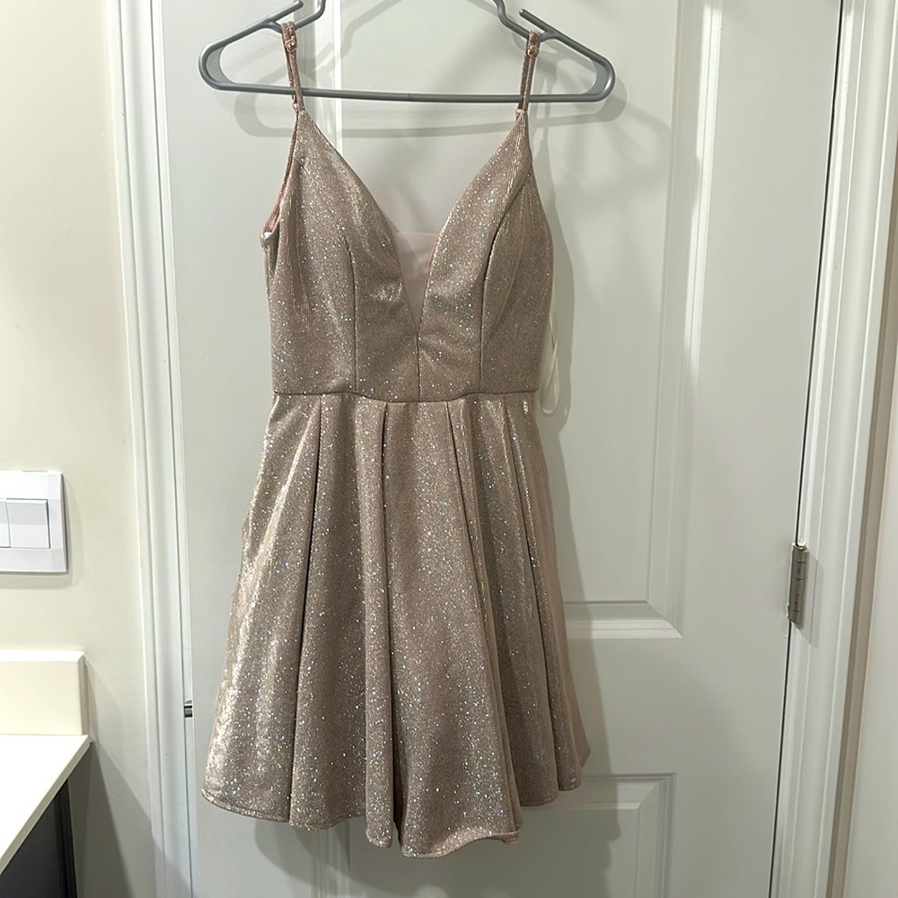 This is a short, fairy pink dress! The dress is super cute and comfortable!